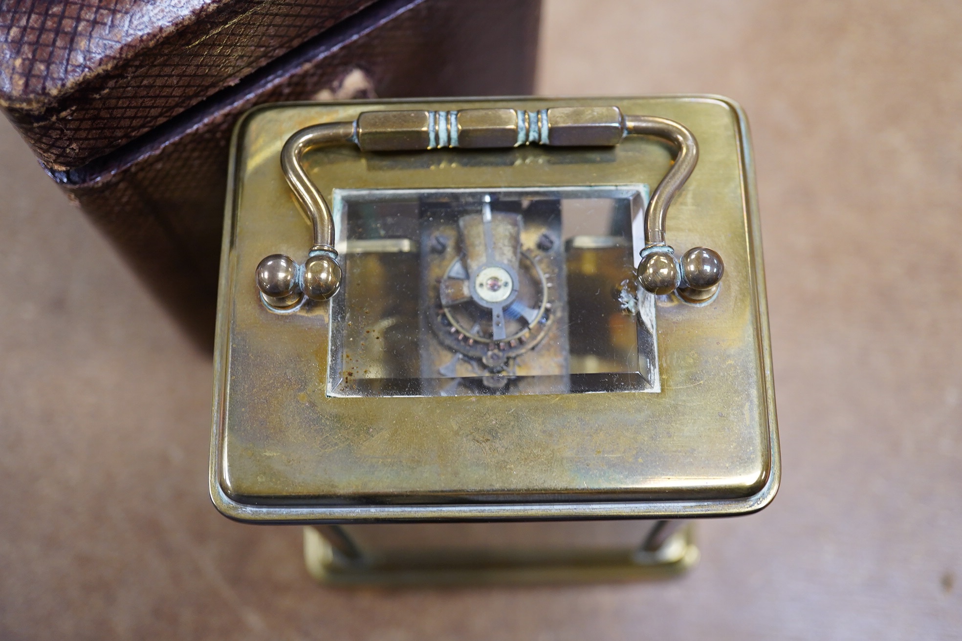 A brass cased carriage timepiece, the enamel dial inscribed ‘Gold & Silversmith’, with case, no key, 13cm high. Condition - good, untested